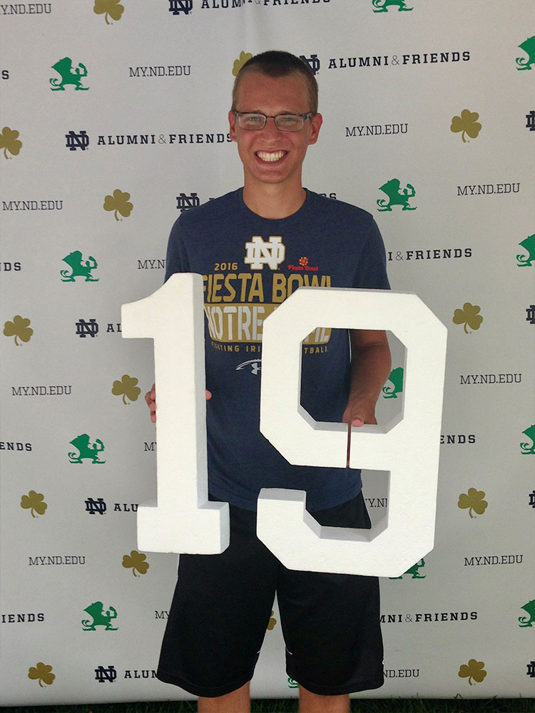 Simon 43 holding 19 by bookstore